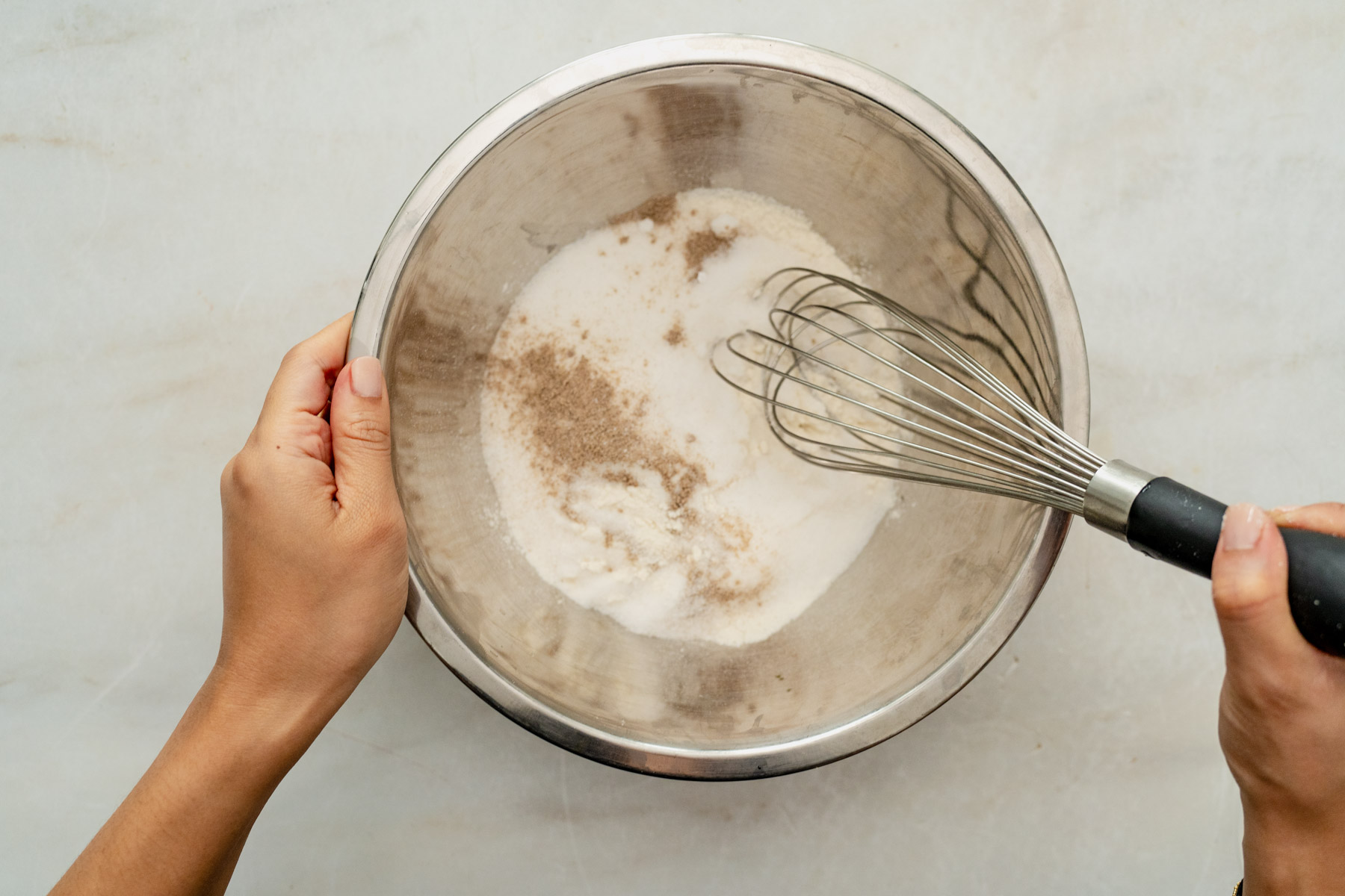 mixing dry ingredients with a whisk,