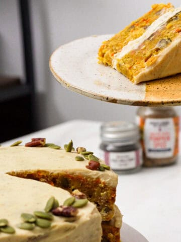 pumpkin carrot cake, slice on the upper right hand corner on a plate.