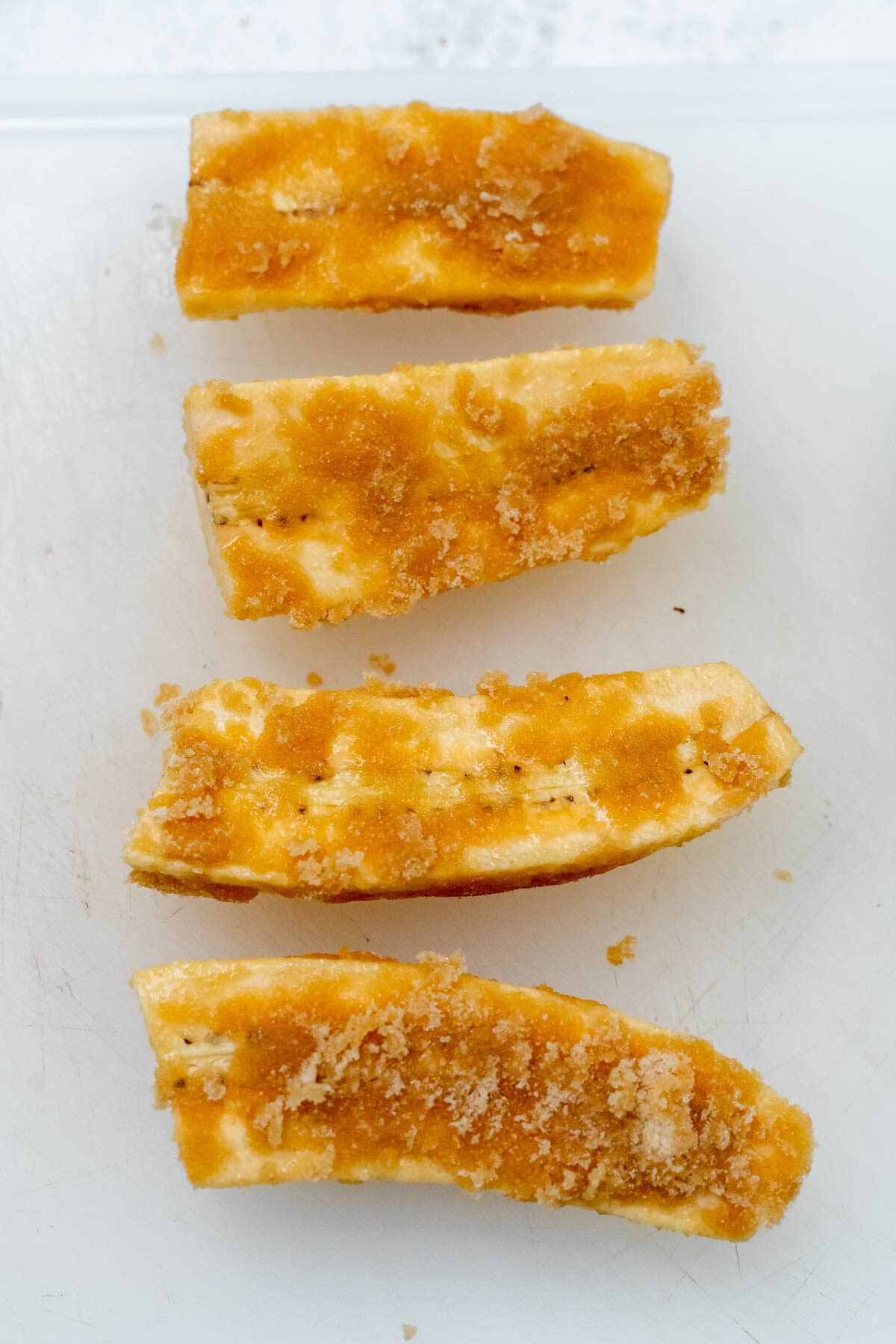 4 banana slices covered in miso sugar mixture.
