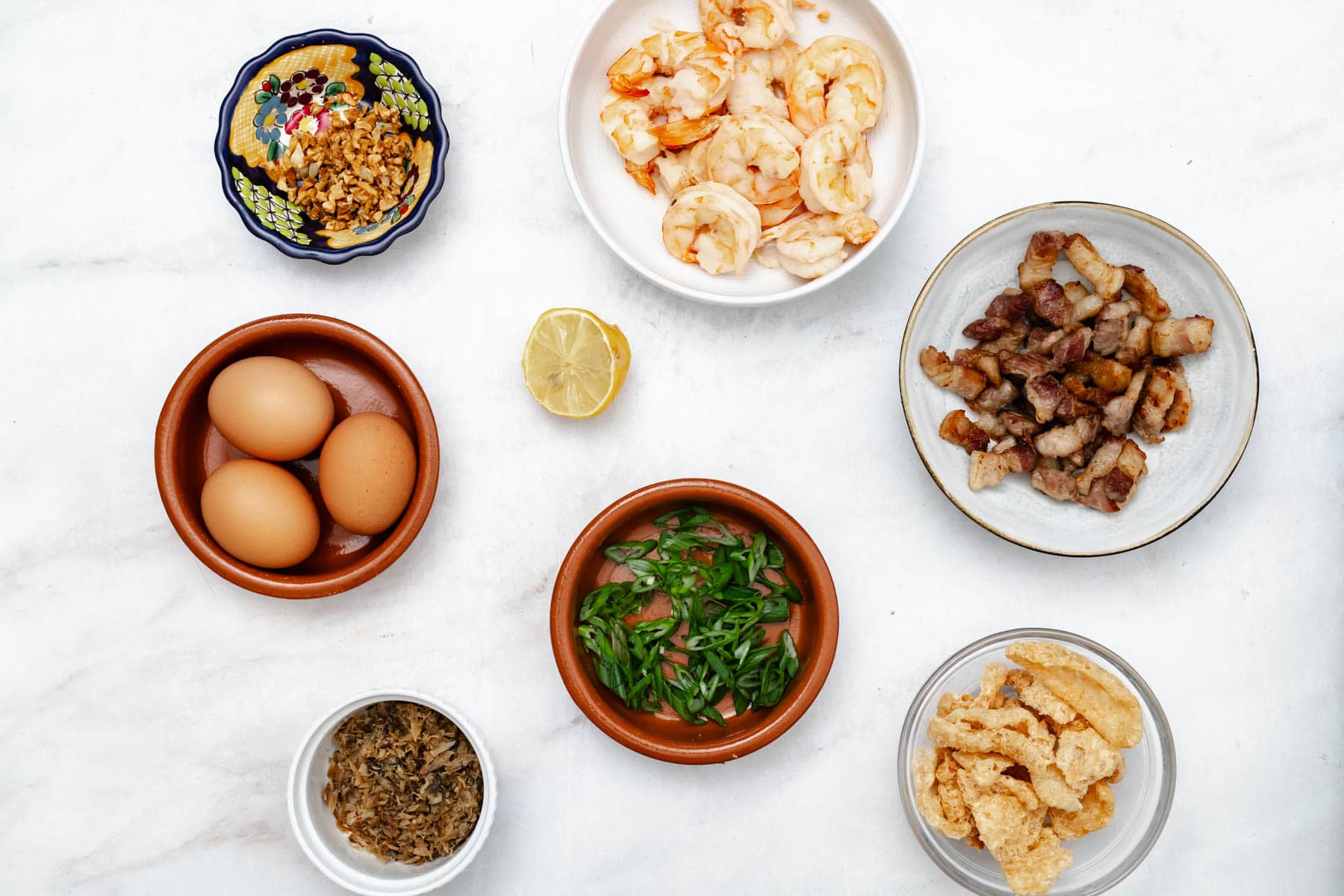 toppings of palabok in bowls.