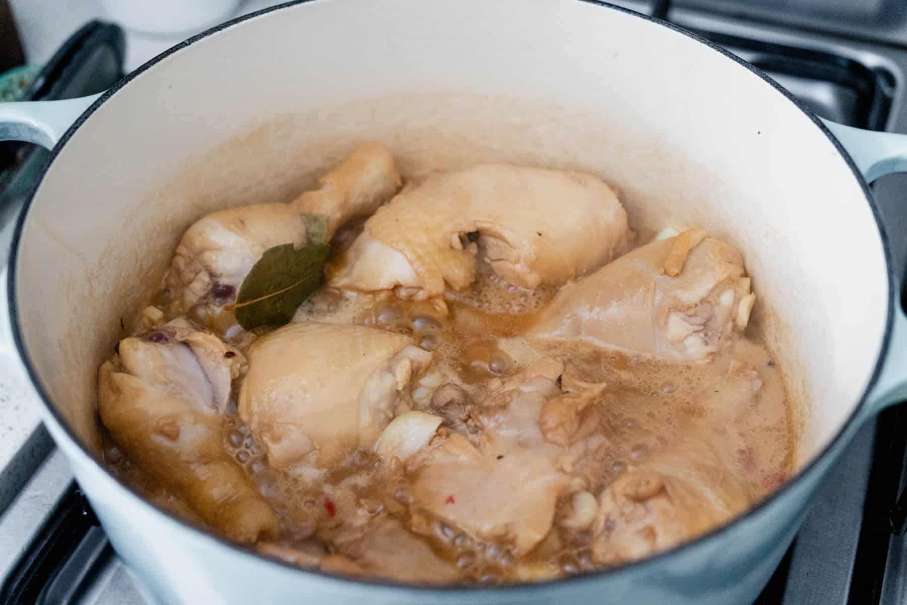 simmering chicken adobo in dutch oven.