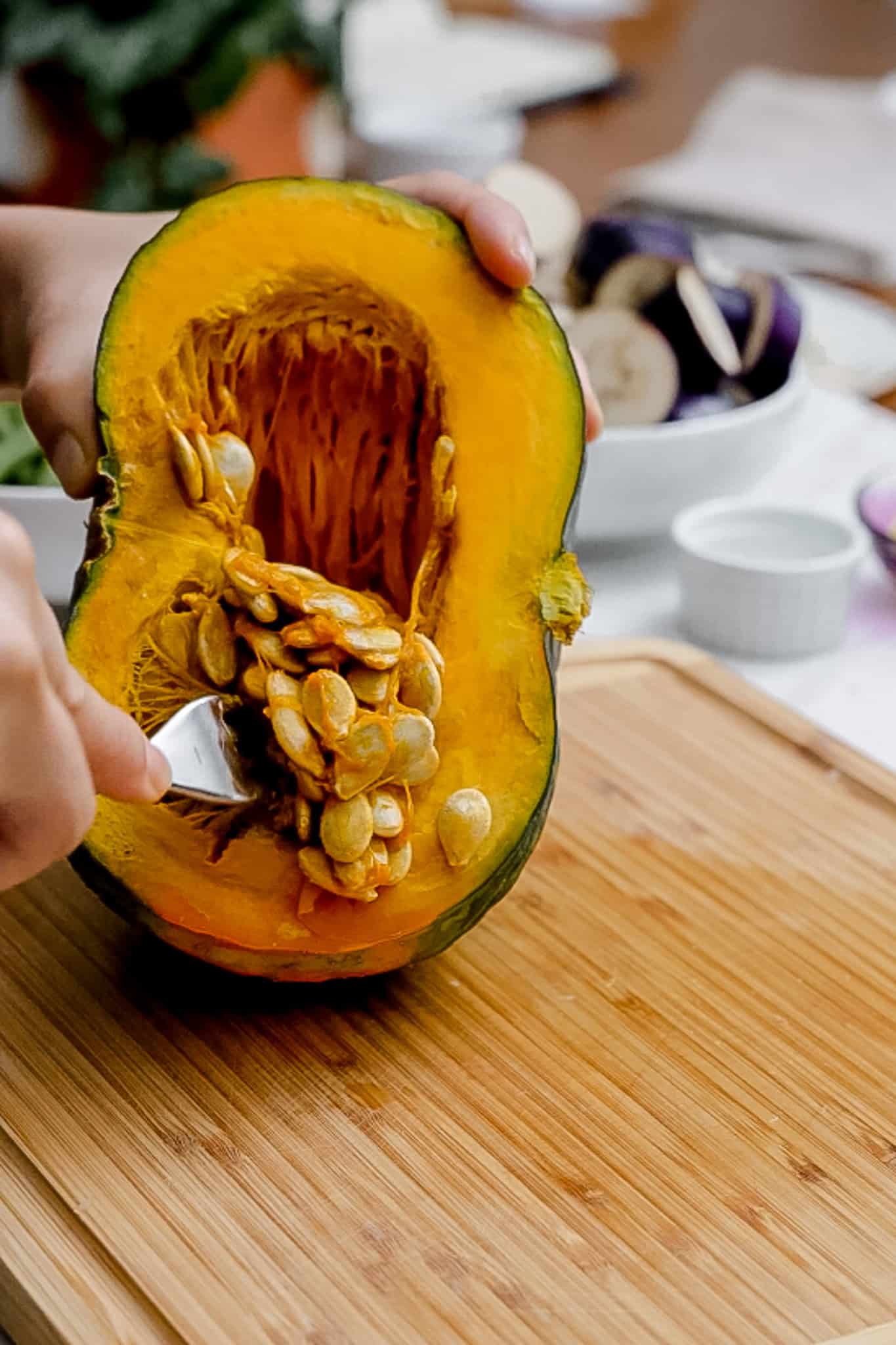 removing seeds from kabocha squash.