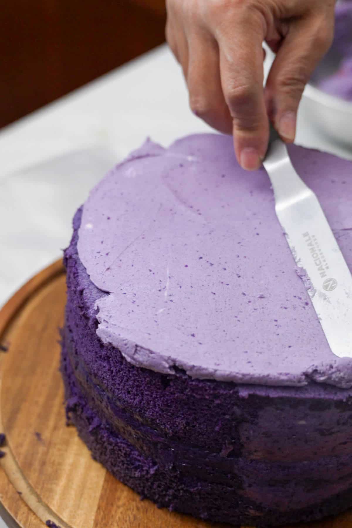 frosting cake with offset spatula.