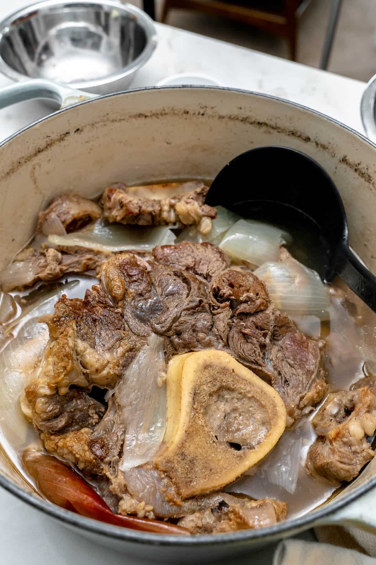 braised beef shank and oxtails in dutch oven.