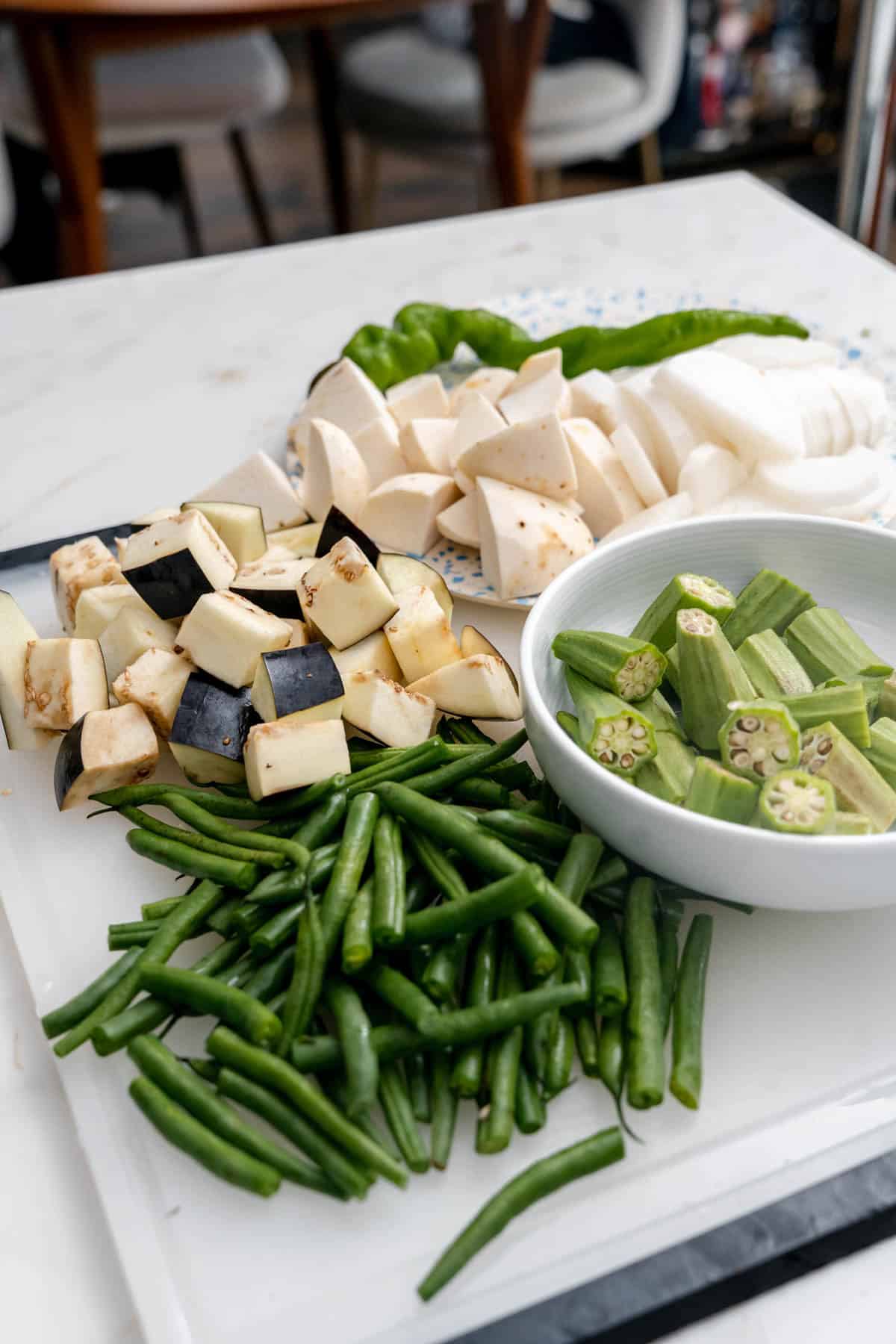 chopped vegetables on cutting board and bowl.