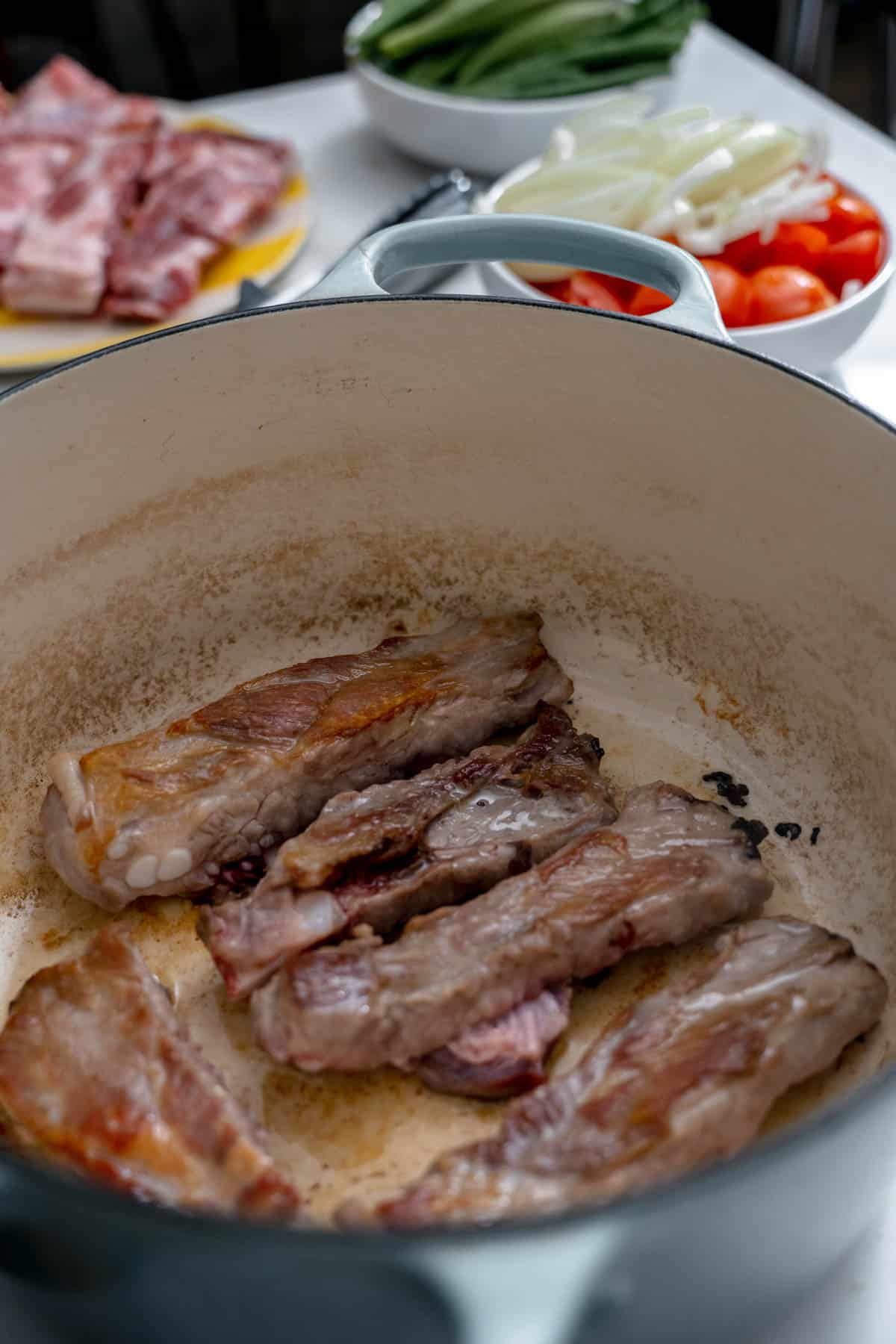 pork ribs seared in a pot.
